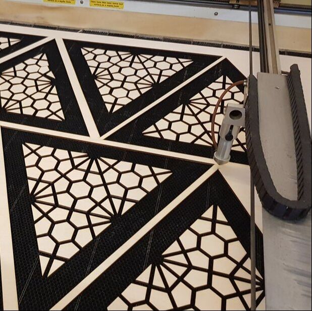 laser cut in use, with black triangles cut out with a pattern