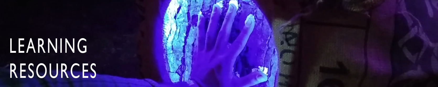 Picture of a hand under UV light with the caption 